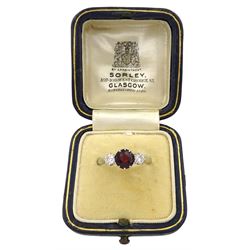 18ct white gold three stone round ruby and diamond ring, ruby approx 1.00 carat, total diamond weight approx 0.40 carat