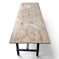 Vintage wooden plank trestle table, on two painted folding stands