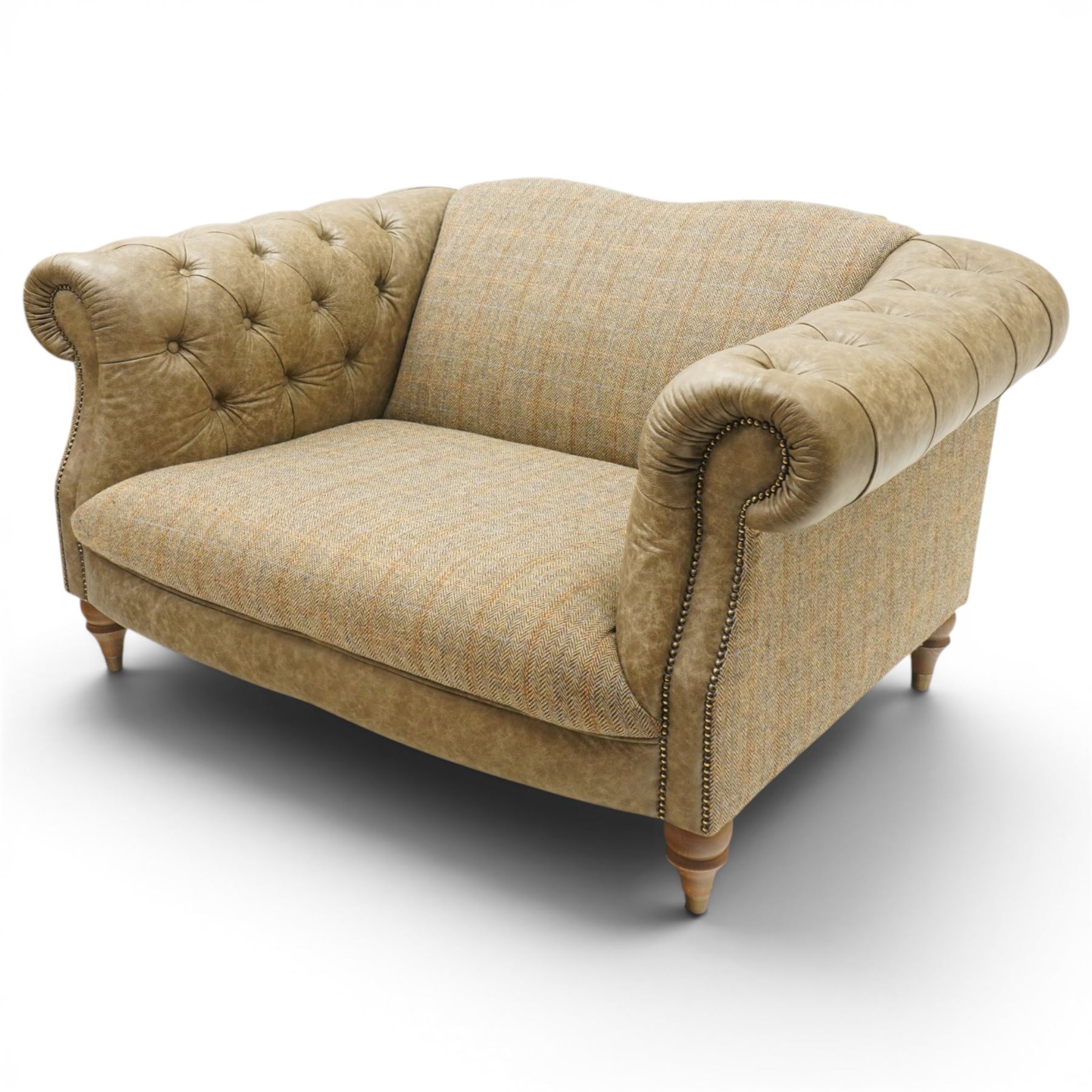 Tetrad - 'Matisse' snuggler armchair or loveseat, Chesterfield shape with rolled arms flanking a serpentine back and front, upholstered in herringbone pattern Harris Tweed and tan leather with close-nailed studwork, on turned feet