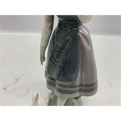 Three Lladro figures, comprising Dutch Girl with Braids no 5063, Dutch Girl with Duck no 5066 and Aracely with Ducks, all with original boxes, largest example H25cm