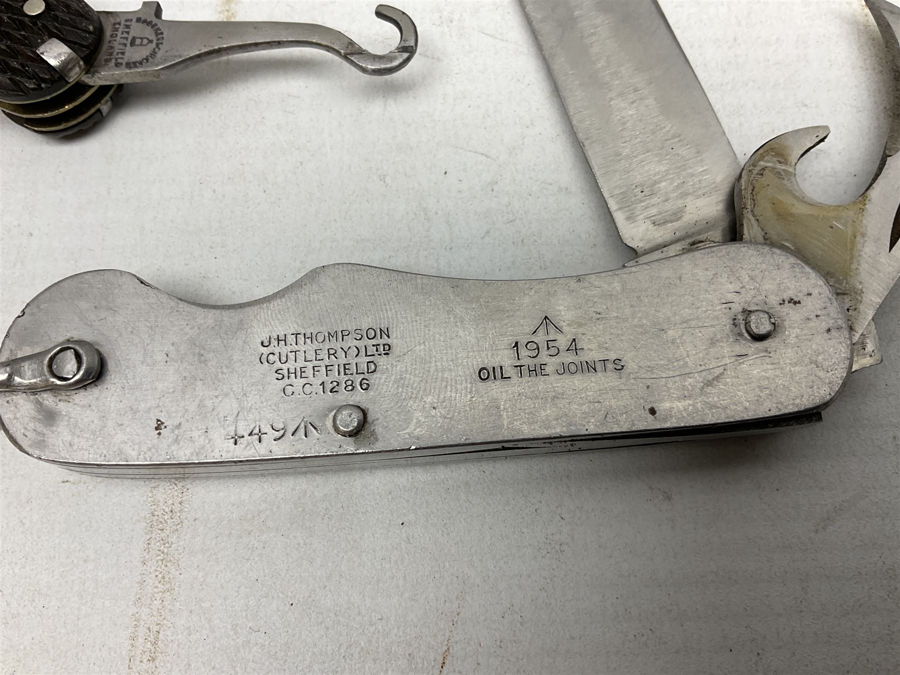 WW2 Gurkha Kukri knife with 34cm curving steel blade and horn handle; in leather covered scabbard with dual belt loops and two horn handled skinning knives L47cm overall; and collection of fourteen military and other folding and pocket knives including WW2 British Army clasp jacknife, J.H. Thompson C.C.1286 army knife dated 1954, Brookes & Crookes multiblade pocket knife etc (15)