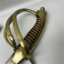 19th century Russian Imperial Navy sword, with 77.5cm curving fullered blade, brass three-bar hilt with lozenge shaped langets and wire-bound leather grip; in polished steel scabbard with one suspension ring L97cm overall