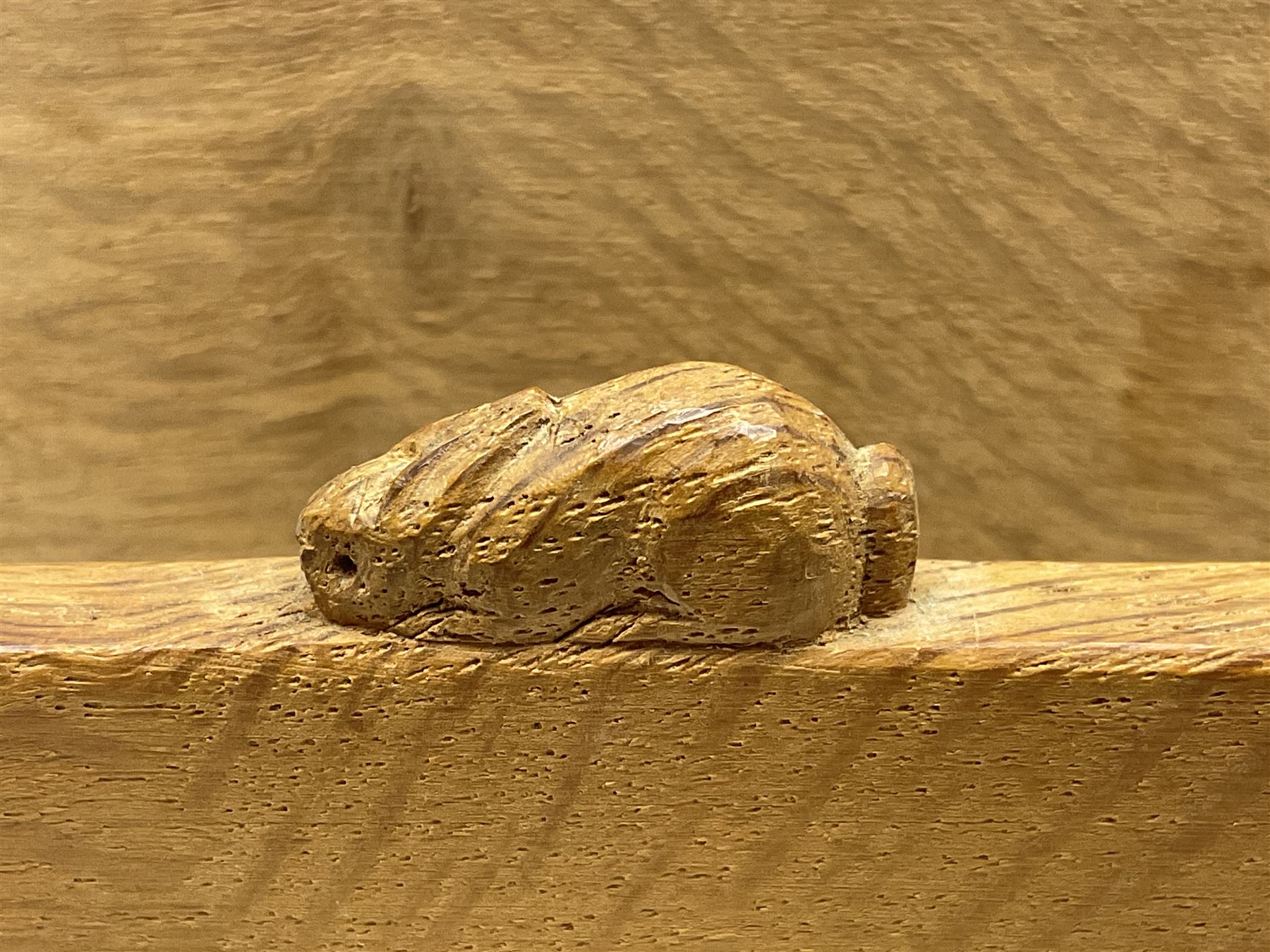 'Rabbitman' oak letter rack of two graduated square panels on a slab base, with carved with rabbit signature, by Peter Heap of Wetwang, H12cm