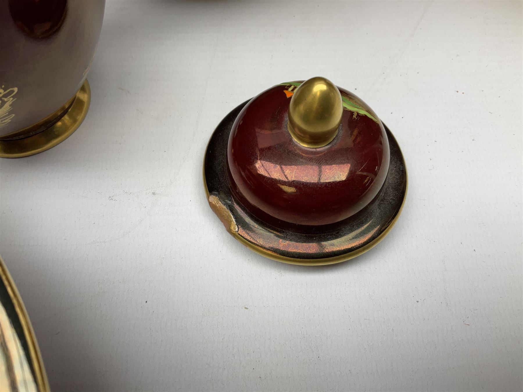 Two Crown Devon Rouge Royale pattern large temple jars with temple dog finial to lid, together with seven other Crown Devon ceramics and two lidded Carlton Ware temple jars in Red Royale, tallest example H47cm (11)