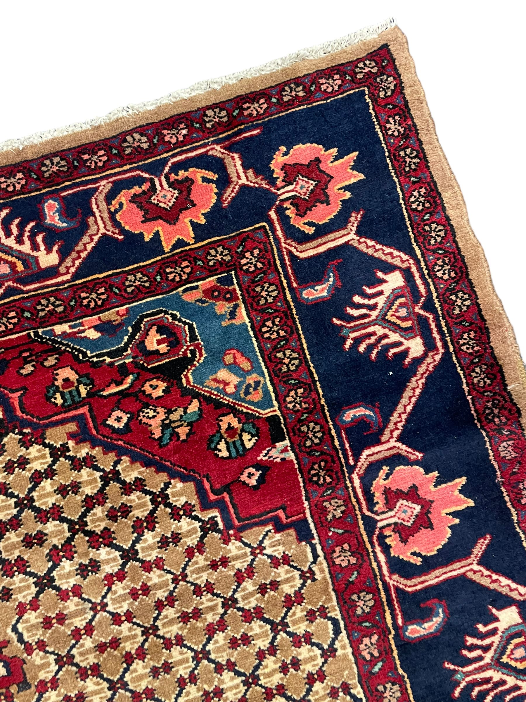 North West Persian Bidjar rug, large floral design shaped pole medallion on a brown field decorated with lattice pattern, the border decorated with trailing branch and stylised plant motifs