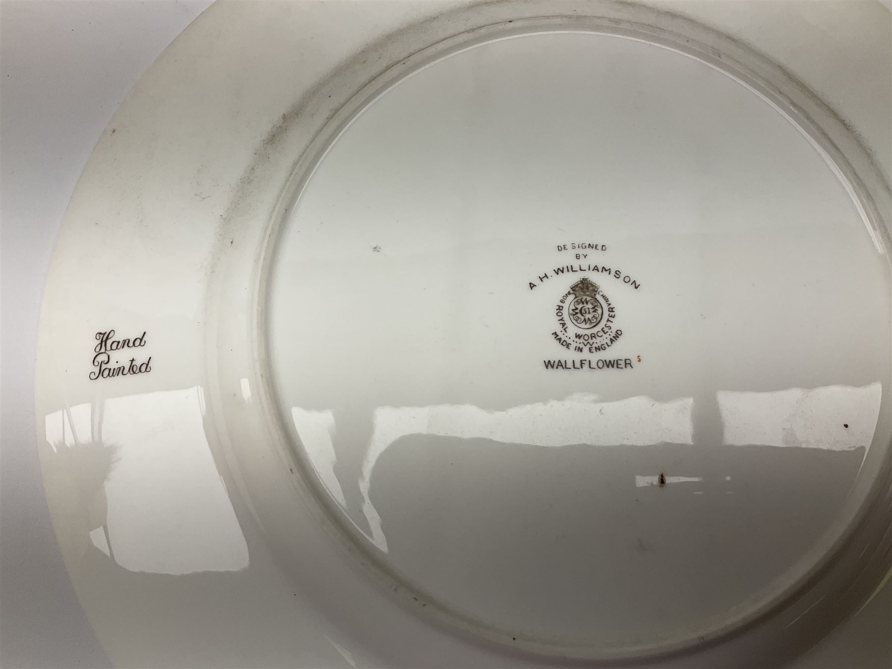 Royal Doulton toby jug of Winston Churchill H23cm and large character jug of Falstaff; together with four collector's plates by Royal Crown Derby, Royal Worcester and Limoges (6)