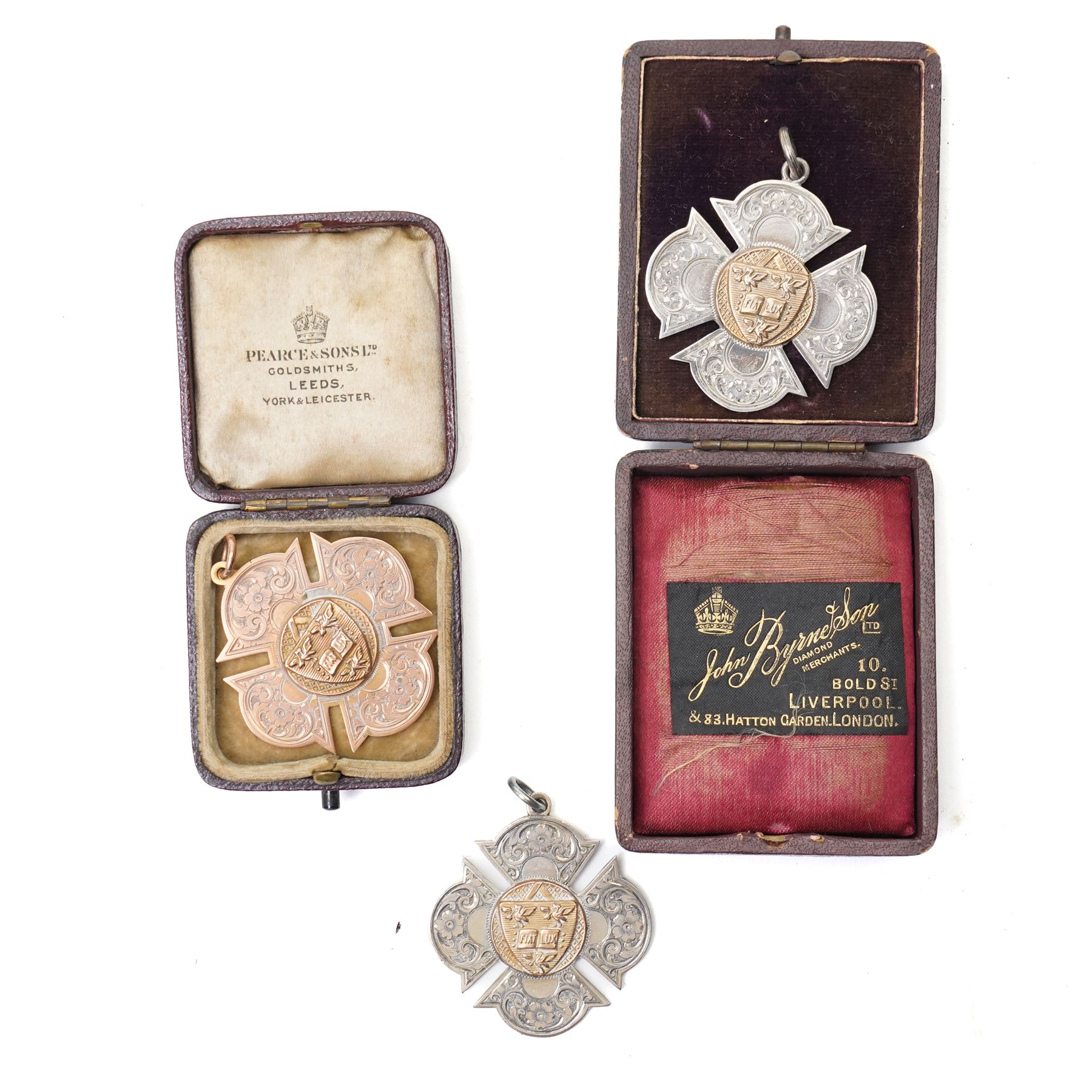 Three early 20th century sporting fob medallions, one 9ct and two silver with gold mounts, awarded to John Barugh Fisher (1888-1924) born in Amotherby, studied at Leeds University and became doctor in 1911, later Captain John Barugh Fisher R.A.M.C., two cased