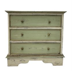 Painted and waxed three drawer chest, on bracket feet
