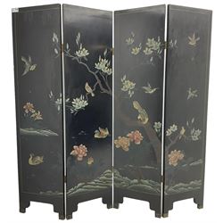 Chinese four-panel folding room screen, black lacquered with a naturalistic scene decorated with trees, birds and flowers