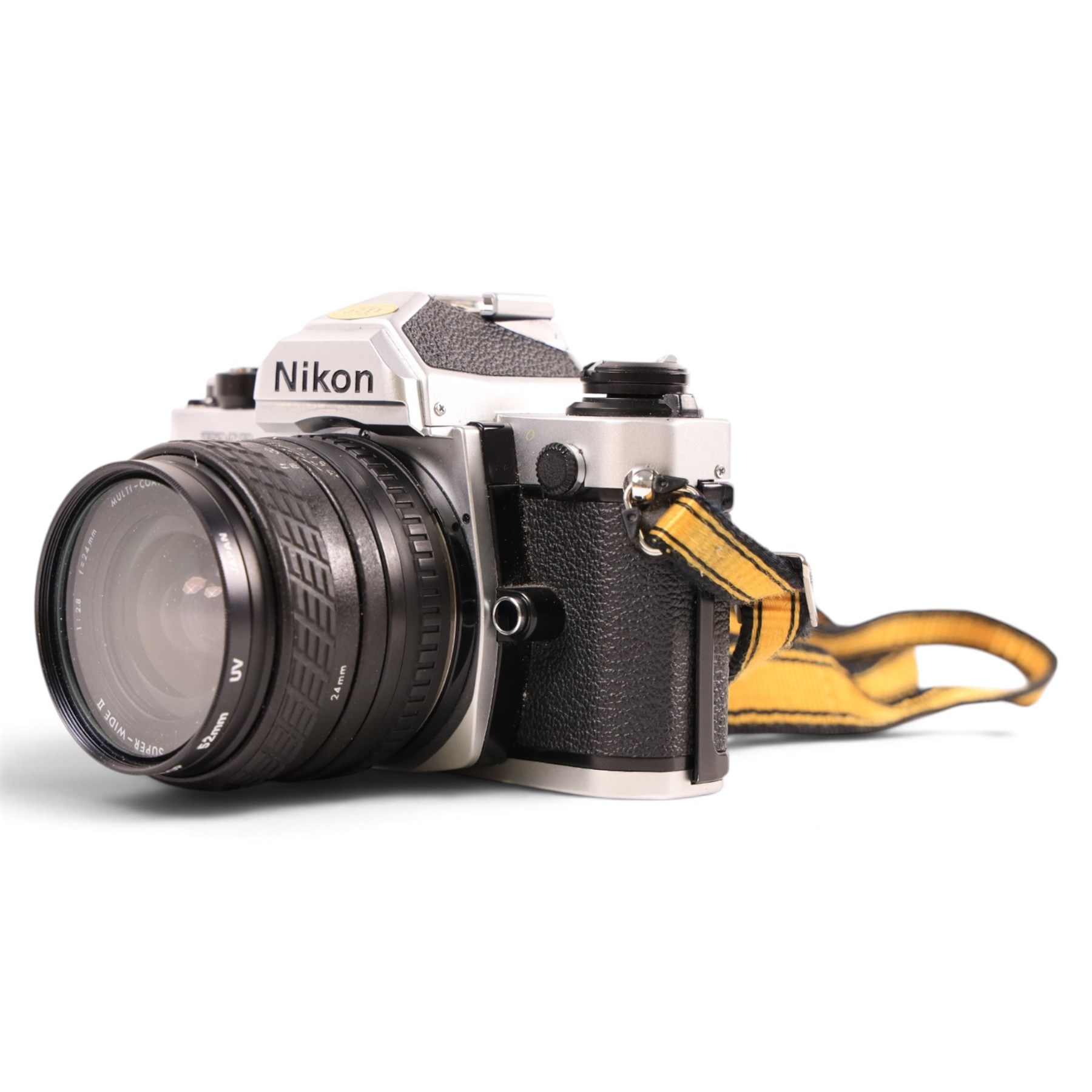 Nikon FM2 film camera body serial no. 7814849 with a Sigma 24mm lens serial no.5083190, camera user manual and Nikon carrying case