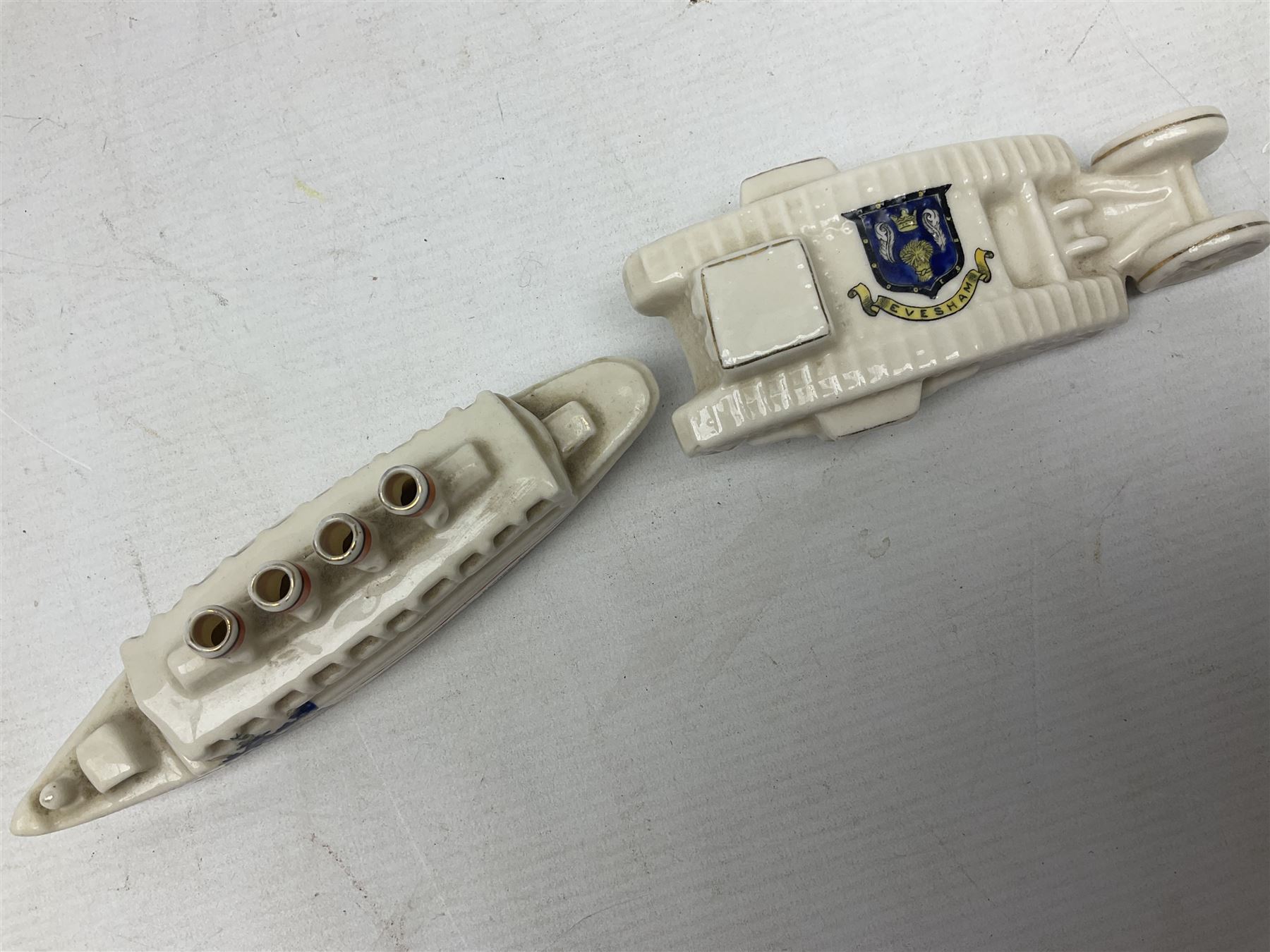 Twelve crested china models of WW1 tanks by Grafton, Arcadian and Carlton china etc with crests from Caistor Lincs, Saffron Walden, Paignton, Evesham etc  , together with a crested china model of the R.M.S Lusitania with New Brighton crest and a two-handled vase for 'The Forts Boxhill' (14)