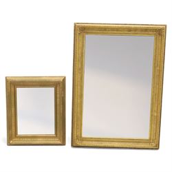 Two late 20th century gilt mirrors, foliate and dart detailing to the frame (H 92cm, W 66c...