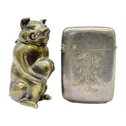 Victorian novelty brass vesta case modelled in the form of a pig holding a money bag, together with a silver vesta, hallmarked 