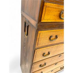 Late Meiji-period Japanese keyaki wood tansu chest, upper section with six sliding woven rattan doors over five drawers, lower section fitted with an asymmetrical arrangement of seven drawers and side cupboard with a hinged door enclosing three additional drawers, iron drop handles to sides