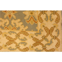  Late 19th/early 20th century European flat woven wool rug, pastel blue ground with repeating stylised motifs throughout, looped wool edging, 321cm x 229cm  