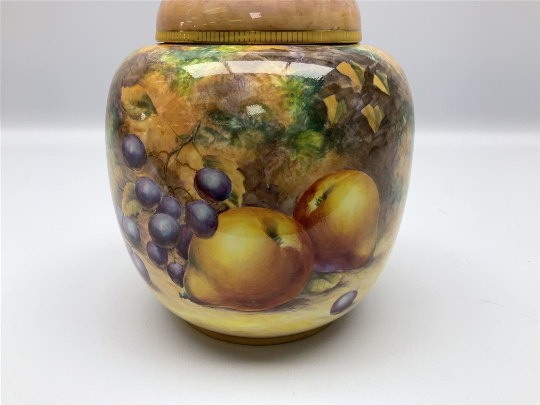 Mid/late 20th century Royal Worcester ginger jar and cover decorated by R Lewis, hand painted with a still life of fruit upon a mossy ground, signed R Lewis, with black printed mark beneath and painted shape number 2826, H17.5cm