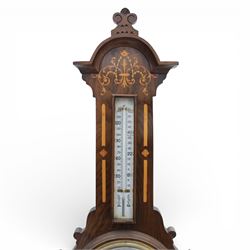 Victorian inlaid rosewood aneroid wall barometer, the circular glass-printed dial with brass bezel, with weather indications for Stormy, Rain, Change, Fair, and Very Dry, with enclosed aneroid movement beneath, shaped case with marquetry scrolls and foliate motifs surmounted by a thermometer with dual Fahrenheit and Centigrade scales, circa 1890-1900
