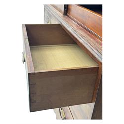 George III mahogany linen press cupboard, projecting moulded cornice over two panelled doors, the interior fitted with two slides and shelf, two short and two long drawers below, shaped apron over bracket feet 