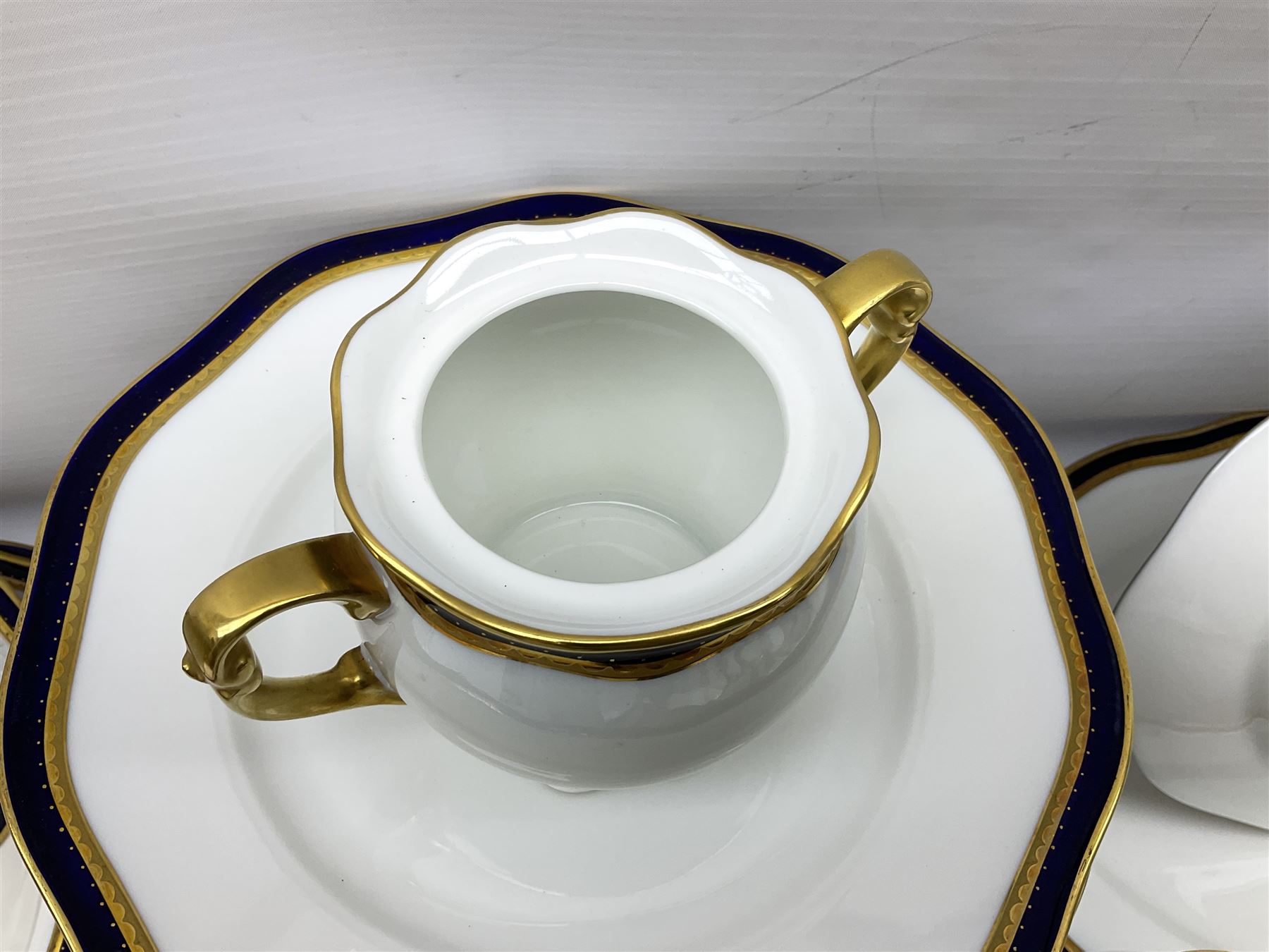 Pirkenhammer of Czechoslovakia Carlsbad pattern tea and dinner for twelve place settings to include dinner plates, soup bowls, side plates, covered tureen, tea cups and saucers, coffee cups and saucers, teapot, milk jug, covered surier, etc, with an addition twelve dinner plates (110)