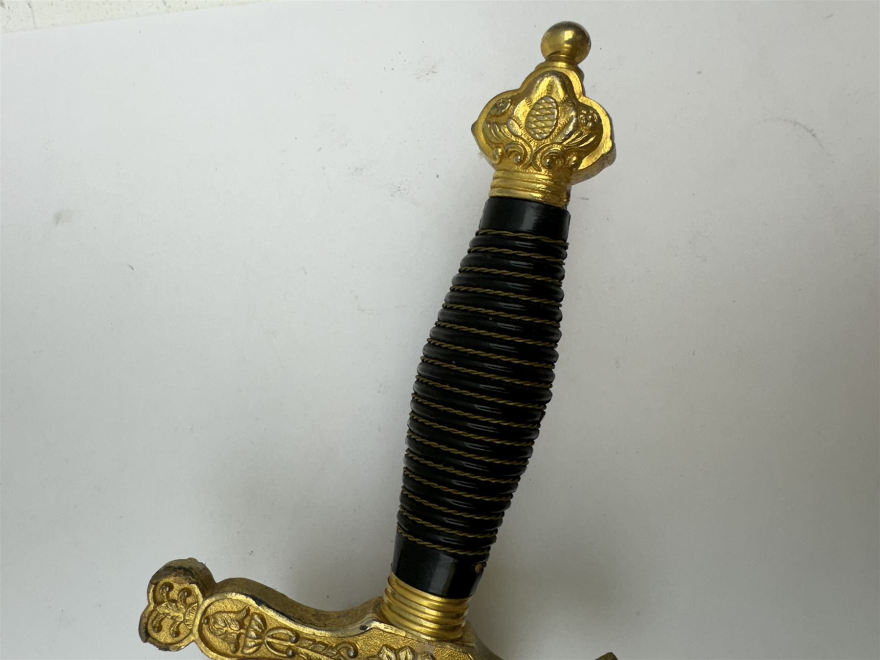 Ceremonial sword, the 75cm blade marked Toledo, Spain, gilt handle with black wire-bound grip  with leather scabbard with gilt tip, L94cm 