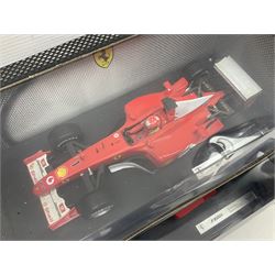 Five Mattel Hot Wheels 1:18 scale die-cast racing cars - Ferrari F1-2000 Michael Schumacher; Ferrari F-2002 Michael Schumacher; Jordan E-110 Heinz-Harald Frentzen; Williams F1 Team FW23Juan Pablo Montoya; and Ferrari F2001 Rubens Barrichello; all boxed (5)