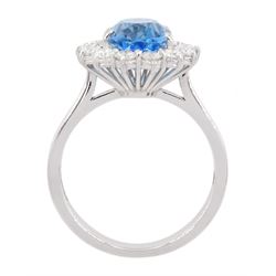 18ct white gold oval cut Swiss blue topaz and round brilliant cut diamond cluster ring, hallmarked