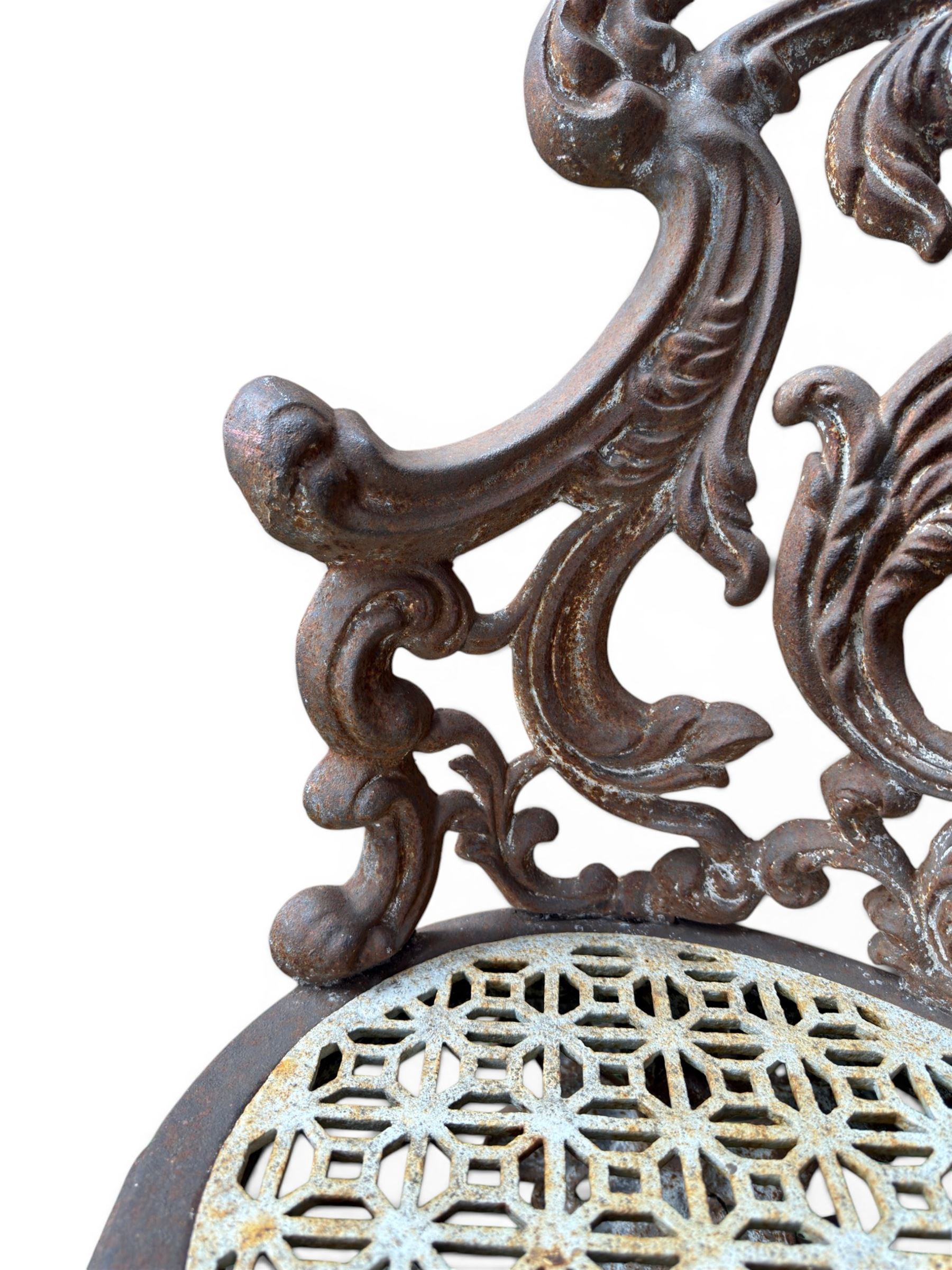 19th century Rococo Revival cast iron garden chair, pierced back comprised of scrolling acanthus leaves, over a pierced geometric white painted drop-in seat, raised on four acanthus and anthemion shaped cabriole supports united by X-frame stretcher