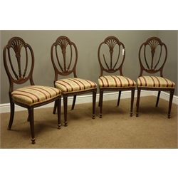  Set four Edwardian mahogany dining chairs, Hepplewhite with pierced floral splats, square tapering legs with shaped spade feet, carved with husks, upholstered in Regency striped fabric  