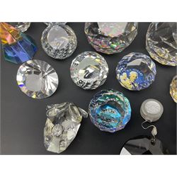 Swarovski Crystal paperweights, to include a globe with dove to the top, pyramid shapes etc, together with a large collection of boxes and stands  