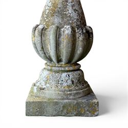 Large weathered cast stone sundial, raised on circular column of bulbous form, square plinth base