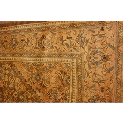  Large Persian carpet, stepped lozenge medallion and spandrels, decorated with Herati motifs, 400cm x 300cm  