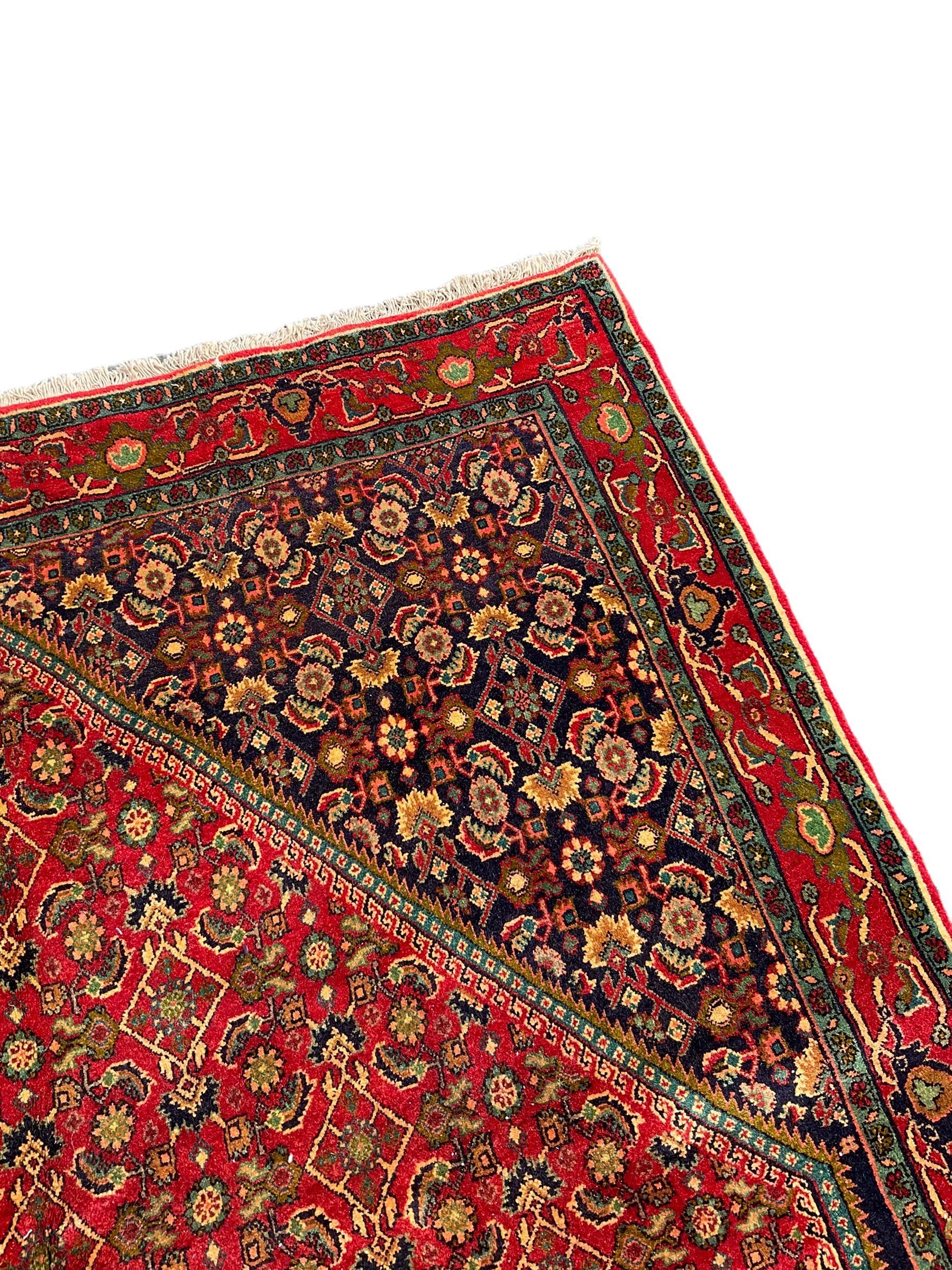Persian Bijar red and blue ground rug, central panel decorated with
