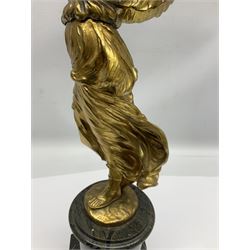 After Oswald Schimmelpfennig (German, 1872-1939): Pair of gilt bronze winged Allegorical female figures, the first example with arm outstretched holding a branch, signed 'Schimmelpfennig 1900', the second with arm raised above her head holding a book and sword in the other, both raised upon marble plinths, H45cm
