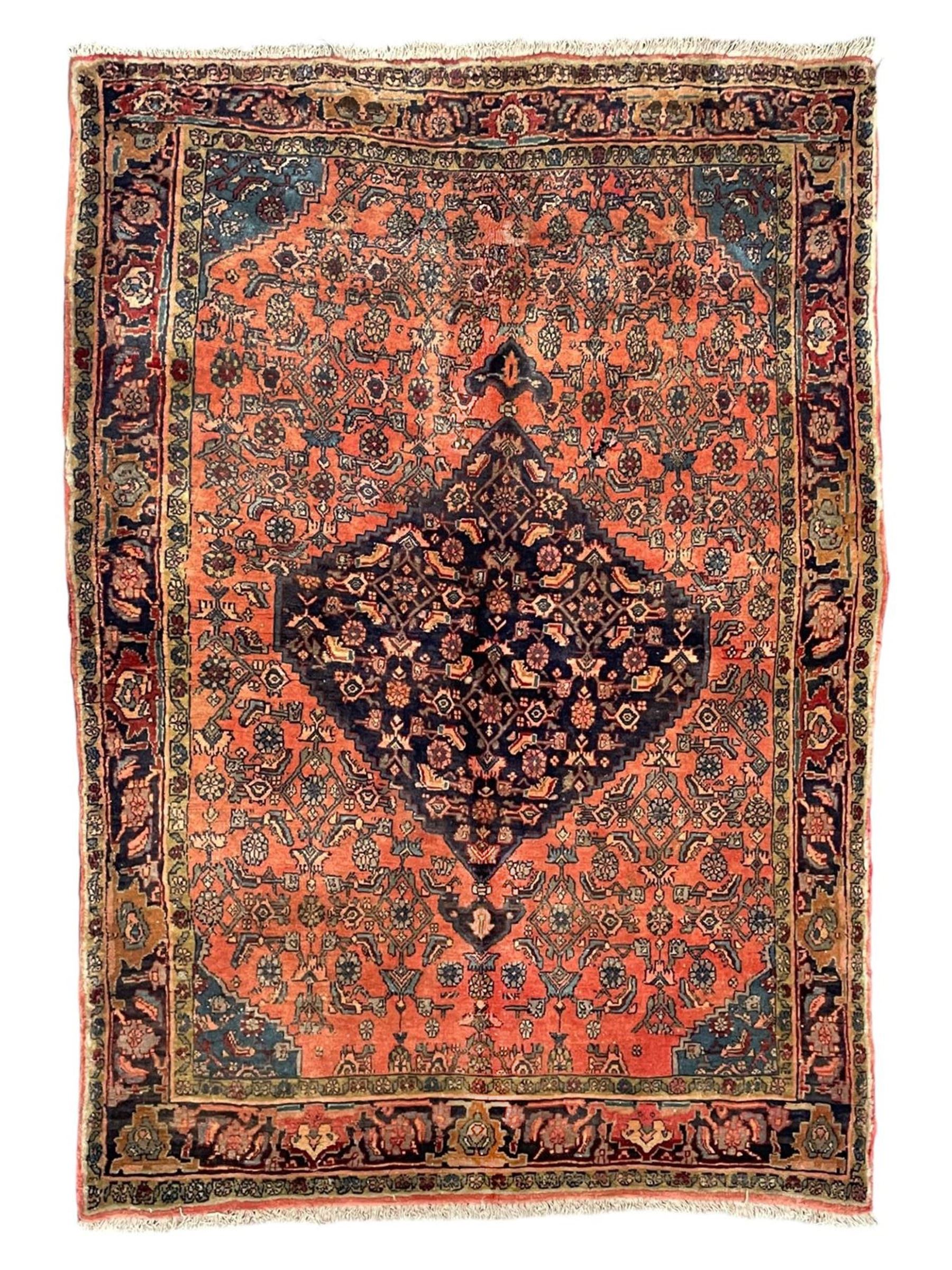 Persian Zanjan pale red ground rug, lozenge medallion and field decorated with floral Herati motifs, the border decorated with stylised plant motifs and trailing branches, floral pattern guard stripes