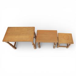 Squirrelman - nest of three tables, each with rectangular top upon octagonal turned supports with squirrel carving, by Wilfrid Hutchinson, Husthwaite