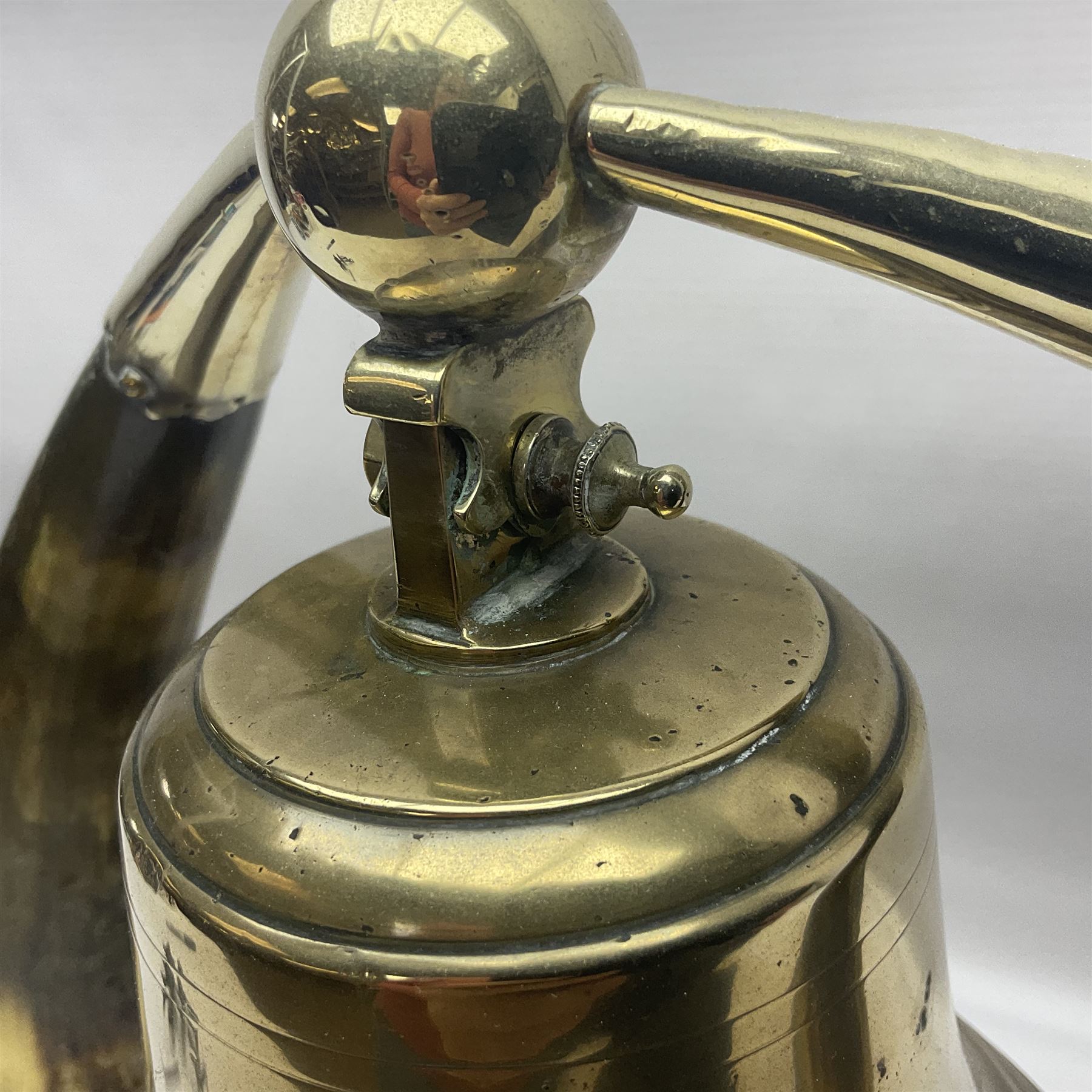 Early 20th century oak and horn dinner bell, the silvered bell suspended from a pair of cow horns, with silver plated mounts and blank shield shaped cartouche, upon square base, H37cm