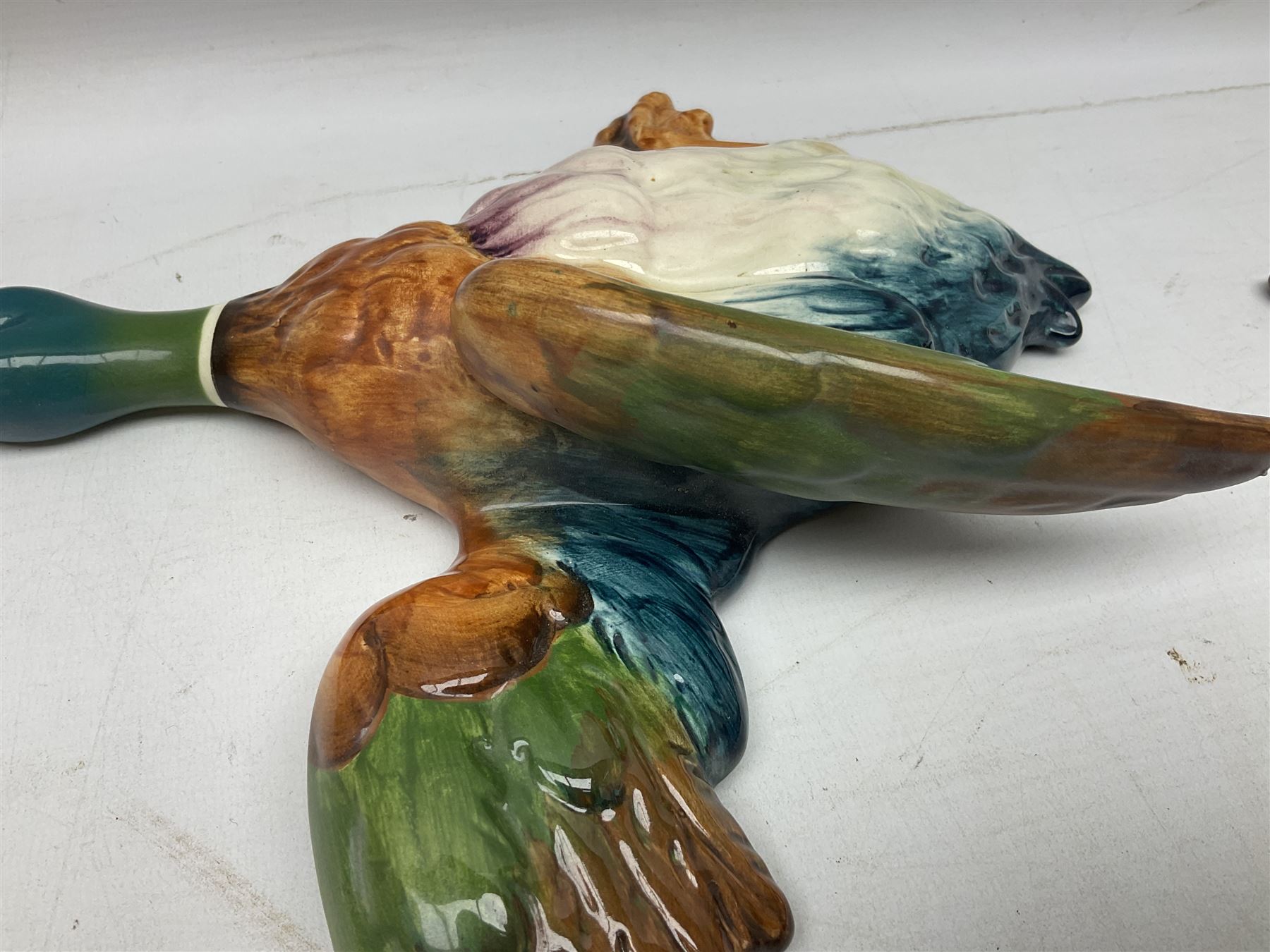 Set of five Beswick graduated wall mounting figures of flying ducks, models from 596/0 to 596/4, largest L29cm