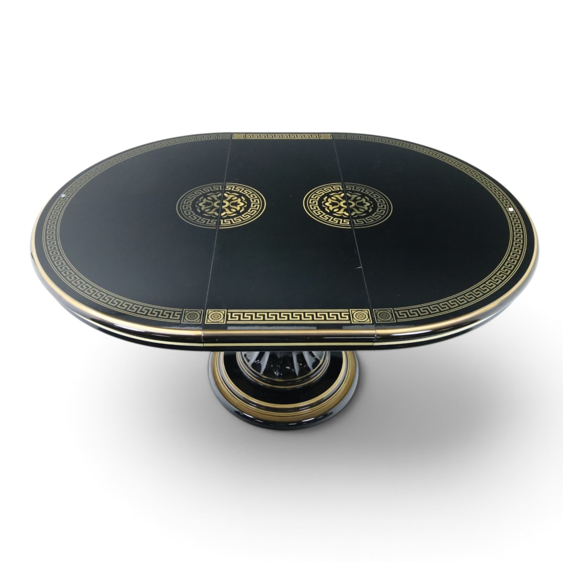 Italian Neoclassical inspired ebonised gloss dining table with four matching chairs,  circular top with additional leaf (Extends to  145cm) with Greek key banding, on a shaped pedestal base with gilt highlights and stepped plinth, the chairs en suite with padded back and seat with Greek key, reeded front supports