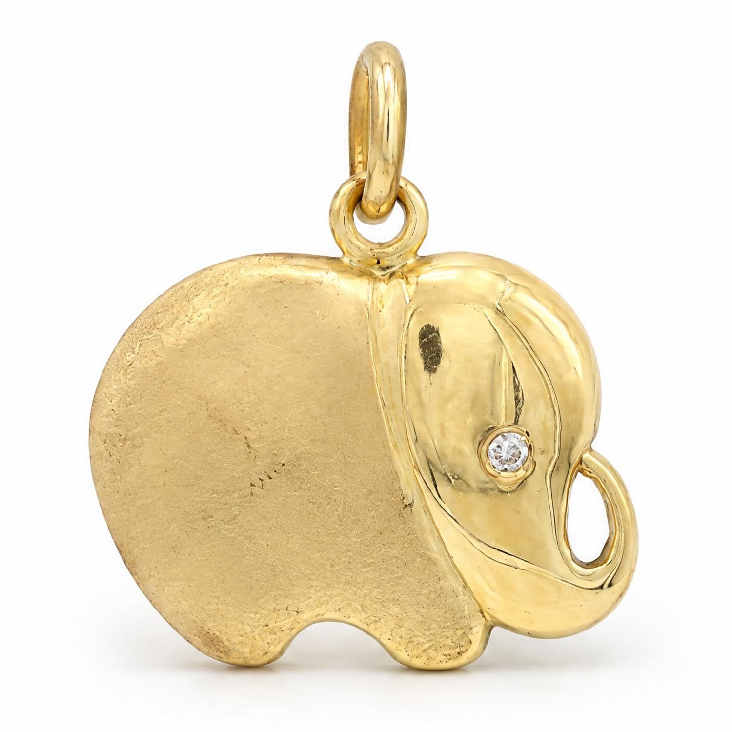 18ct gold elephant pendant, set with a round brilliant cut diamond eye, to a brushed and polished gold body, stamped 750