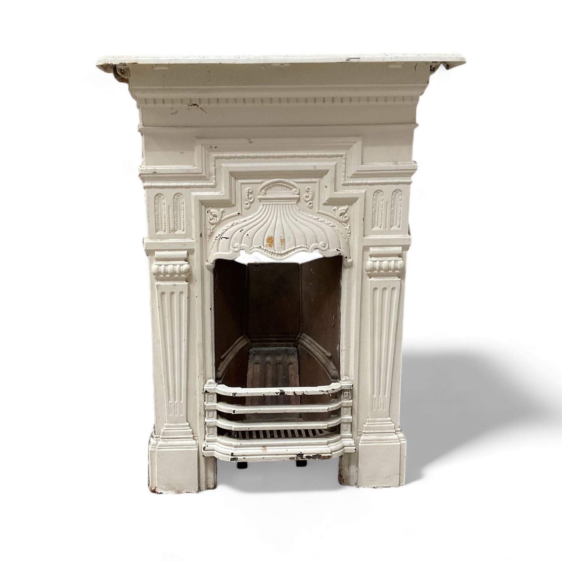 Two Victorian small cast iron fireplaces in a white finish
