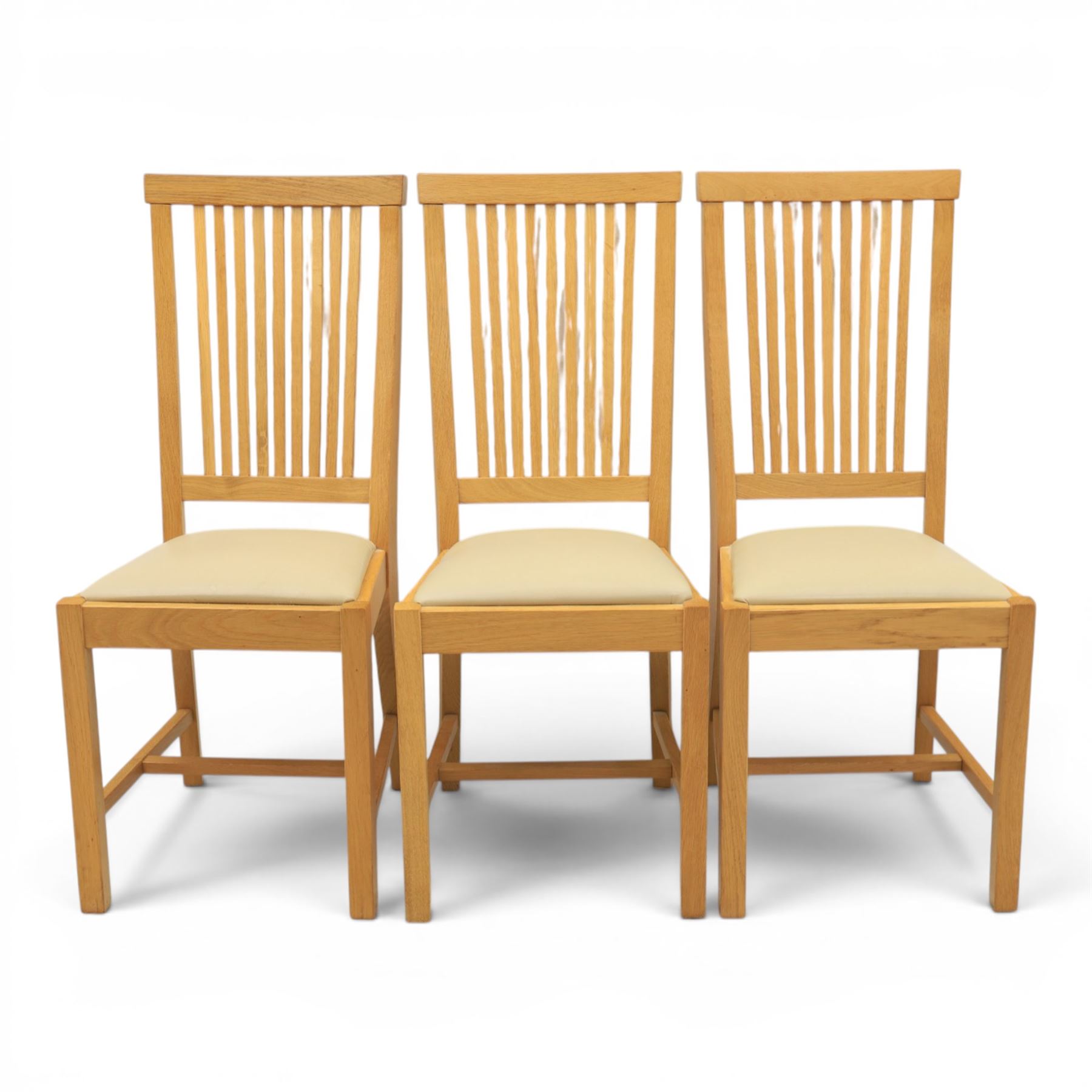 Contemporary oak dining extending table and set of six chairs, with additional leaf  extending to 182cm, chairs with cream upholstered seat