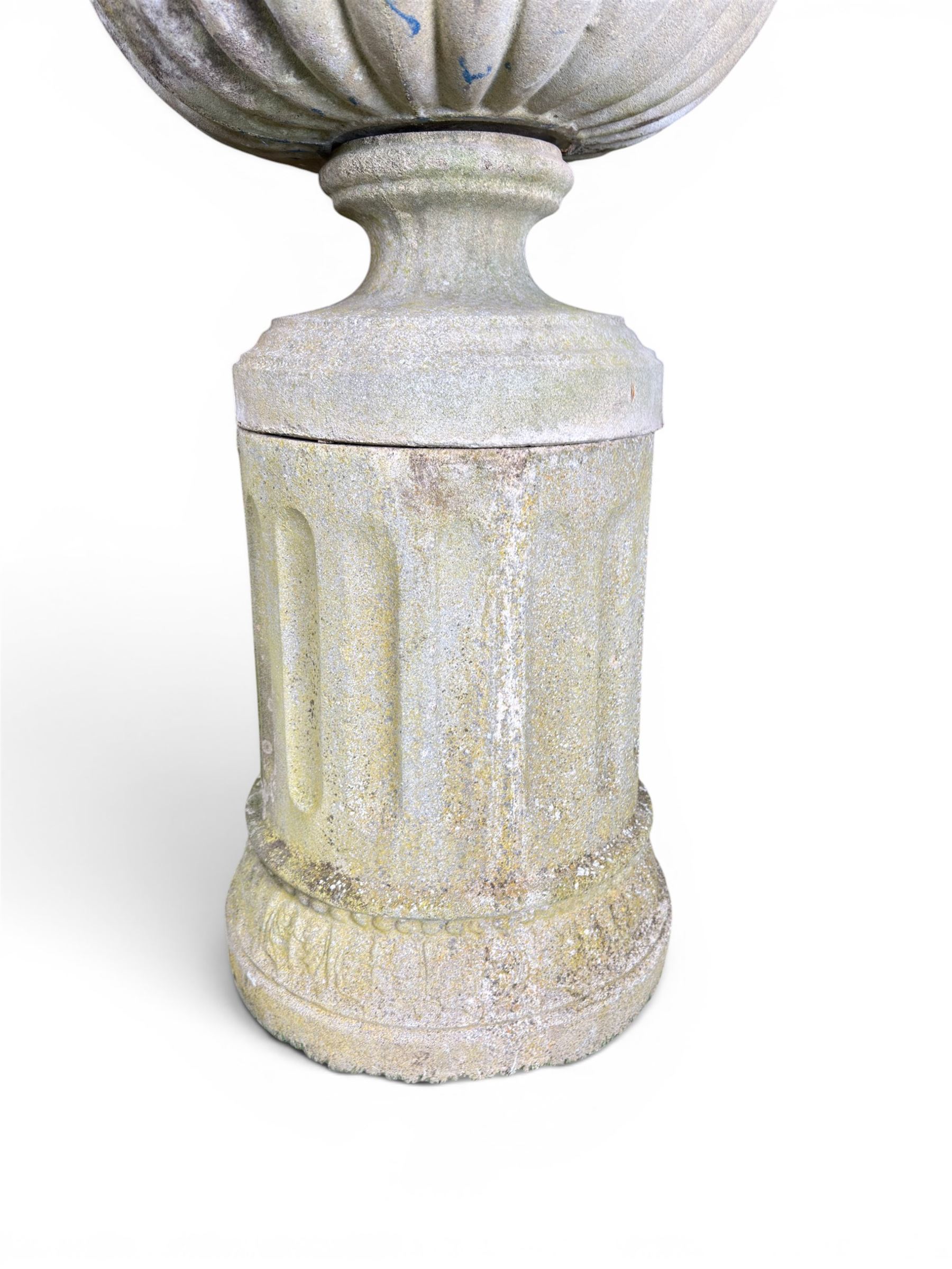 Four 20th century good quality weathered cast stone pedestal urns, circular lobed bowls with rope twist and lattice border, raised on squat base with fluted columns