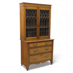 20th century wooden bookcase cabinet, fitted with a pair of leaded glass panel doors openi...