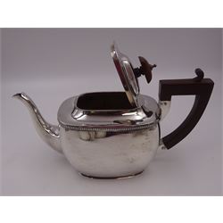 1920s silver three piece tea service, comprising teapot, twin handled sucrier, and milk jug, each of oval form with gadrooned rims, the teapot with Bakelite handle and wooden finial, the sucrier and milk jug with angular handles, teapot and jug hallmarked S Blanckensee & Son Ltd, Birmingham 1925, sucrier hallmarked S Blanckensee & Son Ltd, Chester 1924