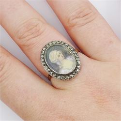 19th century French 18ct gold and silver marcasite portrait ring, set with an oval miniature of a woman on ivory, under glazed panel, with marcasite surround and trifurcated shoulders, hallmarked. This lot has been registered for sale under Section 10 of the APHA Ivory Act