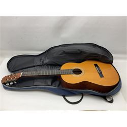 Spanish BM acoustic guitar with mahogany back and sides and spruce top L101cm; in cello carrying case; Roland foot pedal and two Yamaha foot pedals; tin D# organ pipe; folding music stand etc