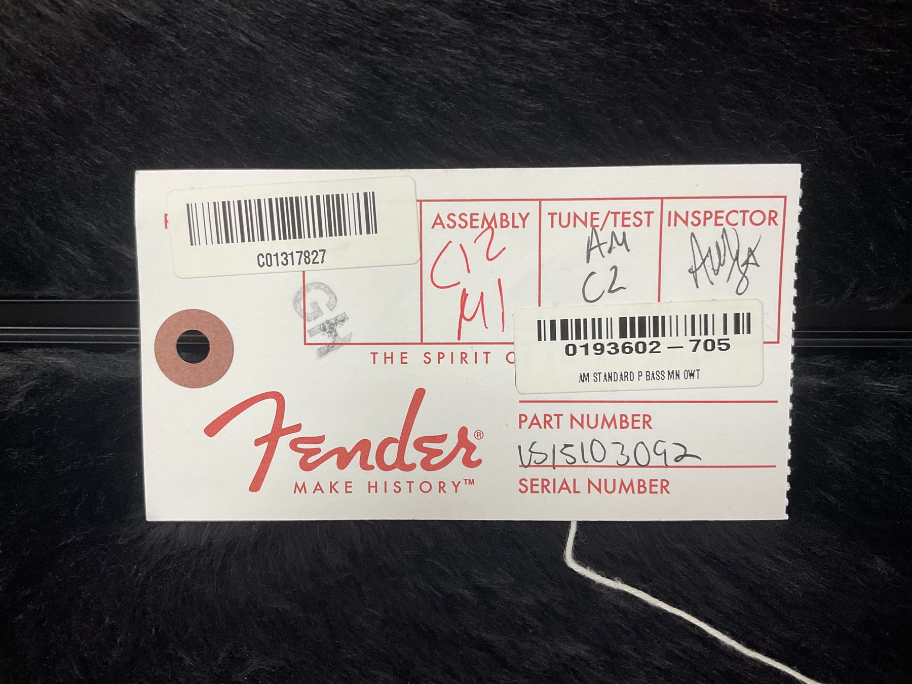 Fender Precision Bass guitar, in Olympic White finish with tortoiseshell effect scratchboard, serial no US15103092, in black Fender hard case with Fender strap and warranty card, guitar L116cm