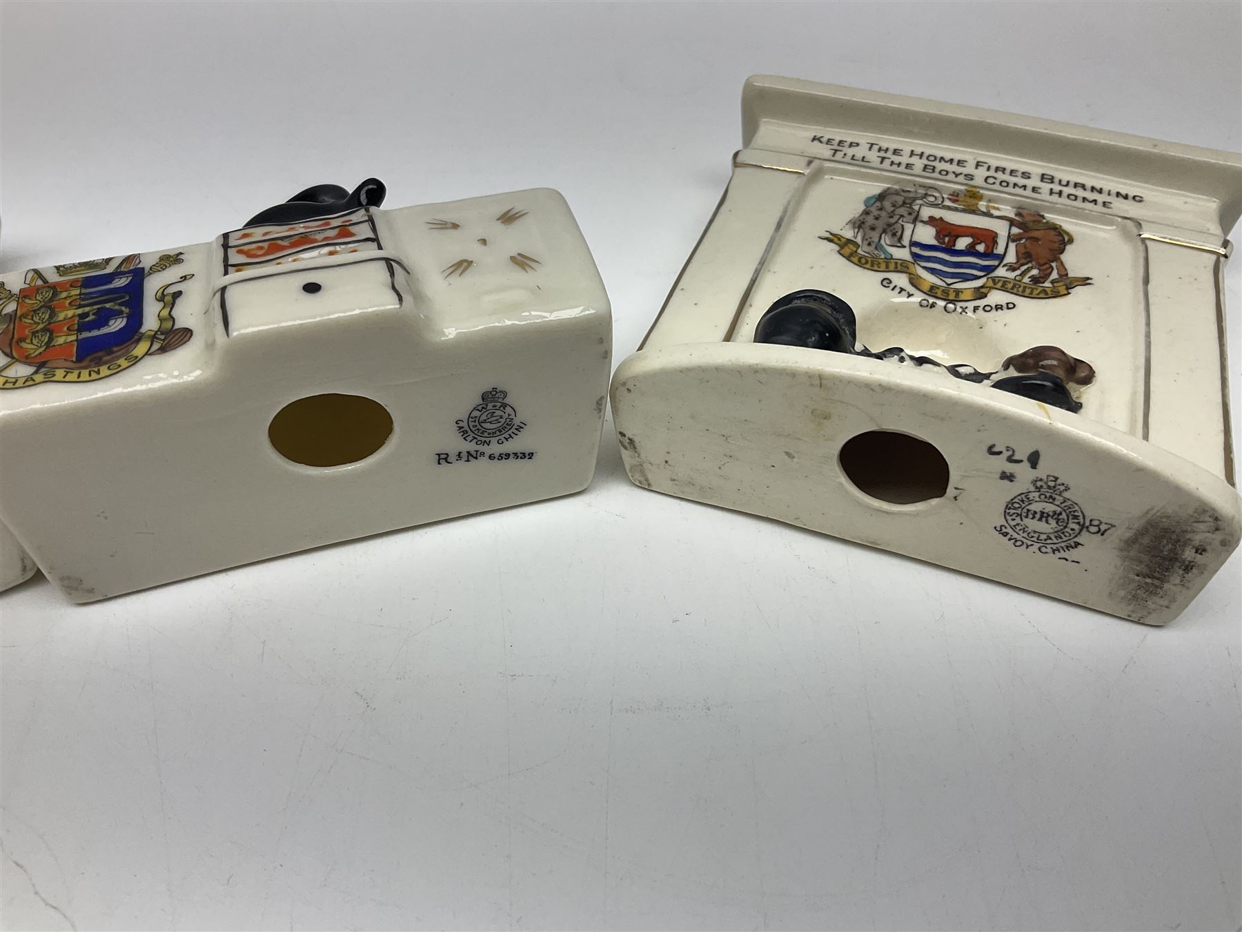 Ten WW1 crested china military models comprising seven field ambulances and three 'Home Fires Burning' fire-surrounds/range; various makers including Willow Art, Arcadian China, Grafton China, Savoy China, Carlton China etc; various crests including Devon, Aldershot, Portsmouth, West Ham, Coventry, Oxford, Hastings, Brighton etc (10)