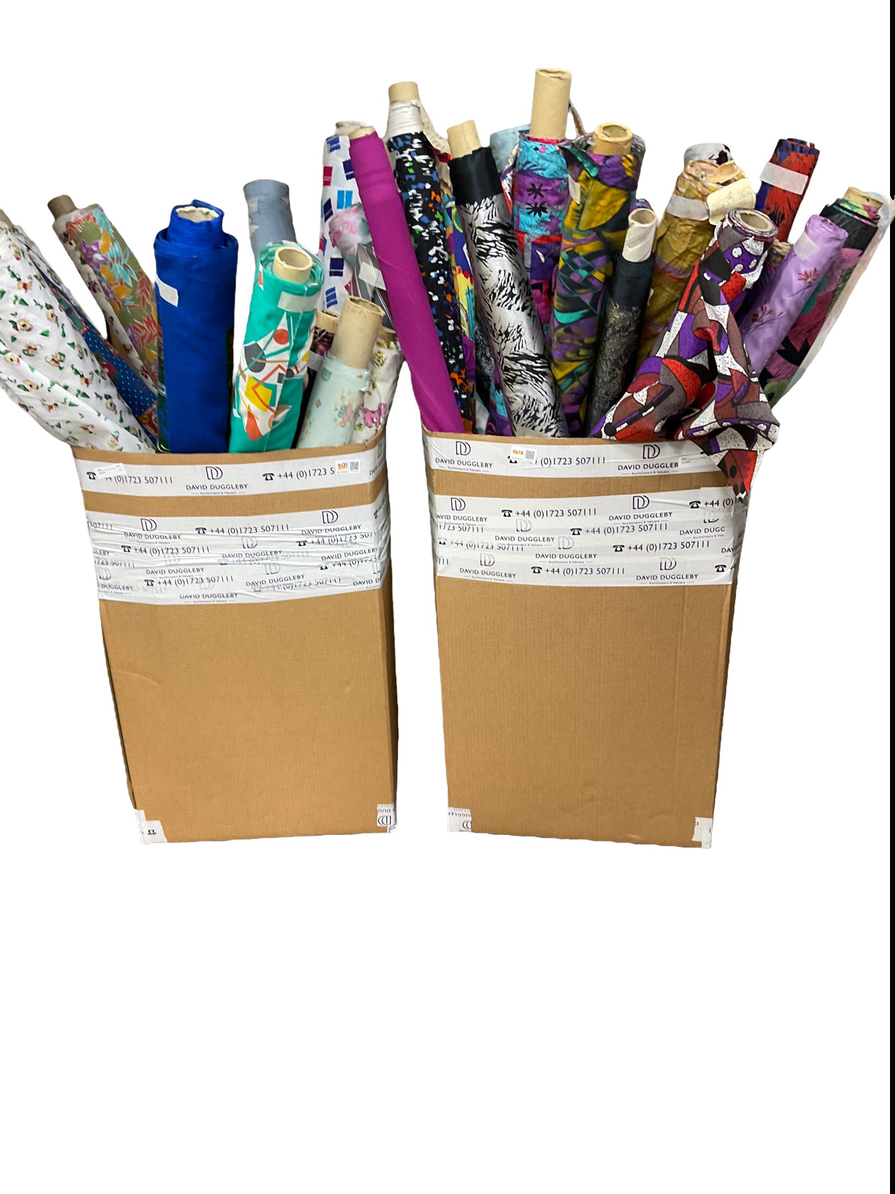 Haberdashery Shop Stock: Various rolls of fabric including metallic printed stage satin, abstract and geometric patterns, children's and festive fabric, and others (qty) in two boxes