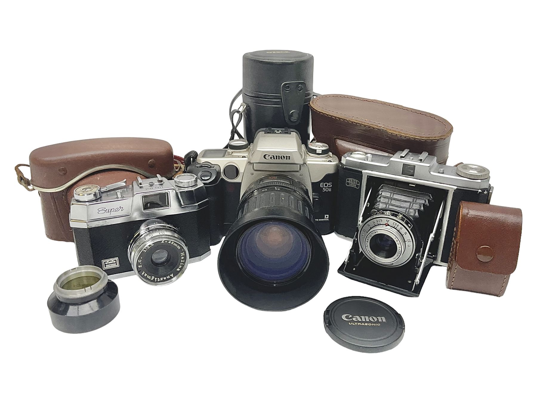 Canon EOS 50e camera body, serial no 8305671 with 'Canon Zoom EF 35-135mm 1:4-5.6' lens together with Halina 35X super camera body, with 'Halina Anastigmat f.c. 1:3.5 f=45mm' lens and other camera equipment 